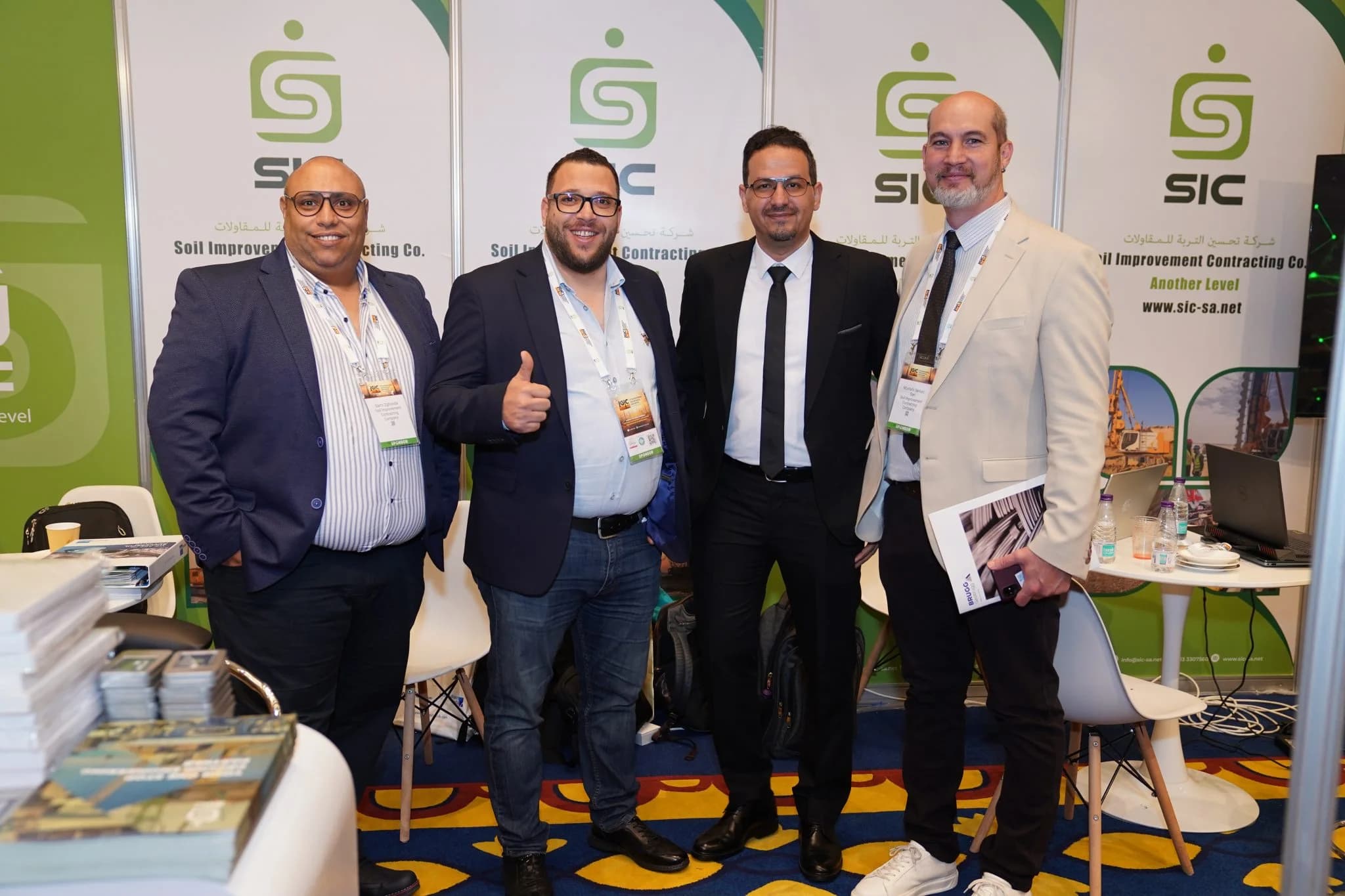 Exhibitors at their stand during a previous IGIC conference